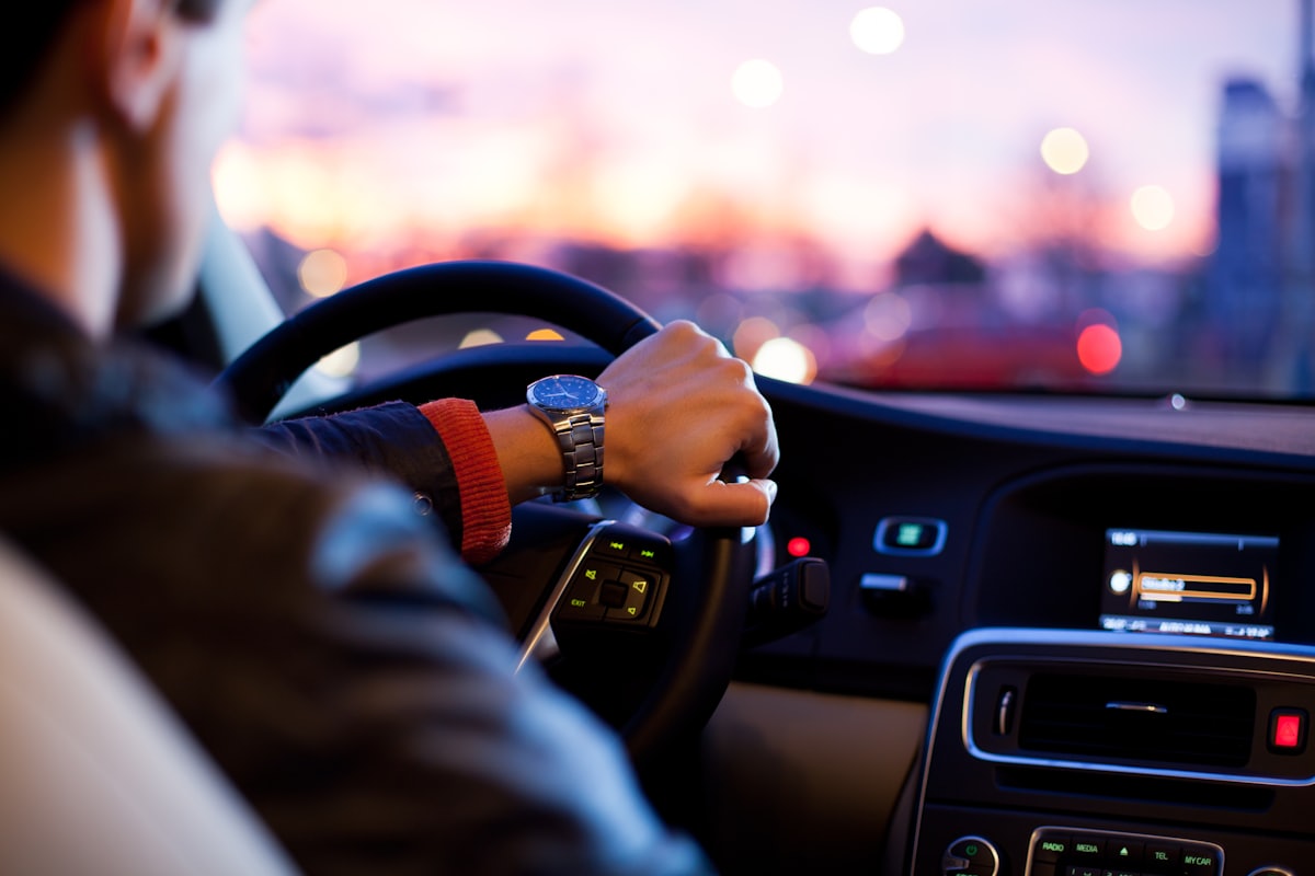 Car driving on a winter highway in low light
